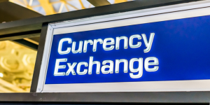 A brightly lit Currency Exchange sign, representing international financial services and money exchange solutions.