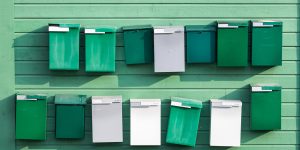 Green mailboxes symbolizing dedicated IBAN business accounts for global financial operations through Zolvat